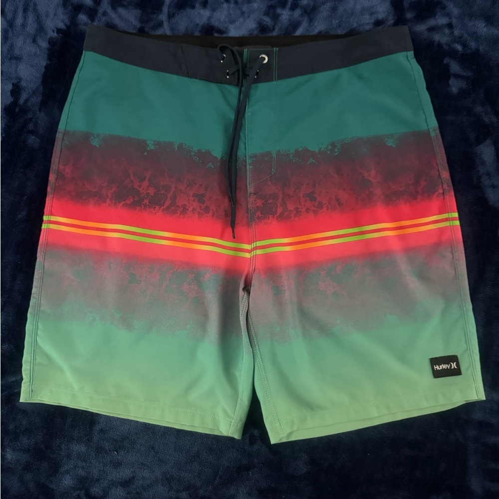 Hurley Men's Teal and Red Board Shorts
Size 34
20”